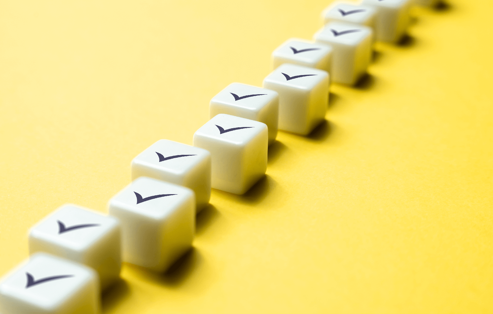 Image shows 10 blocks arranged in order as progressive steps, each block has a tick mark on top surface